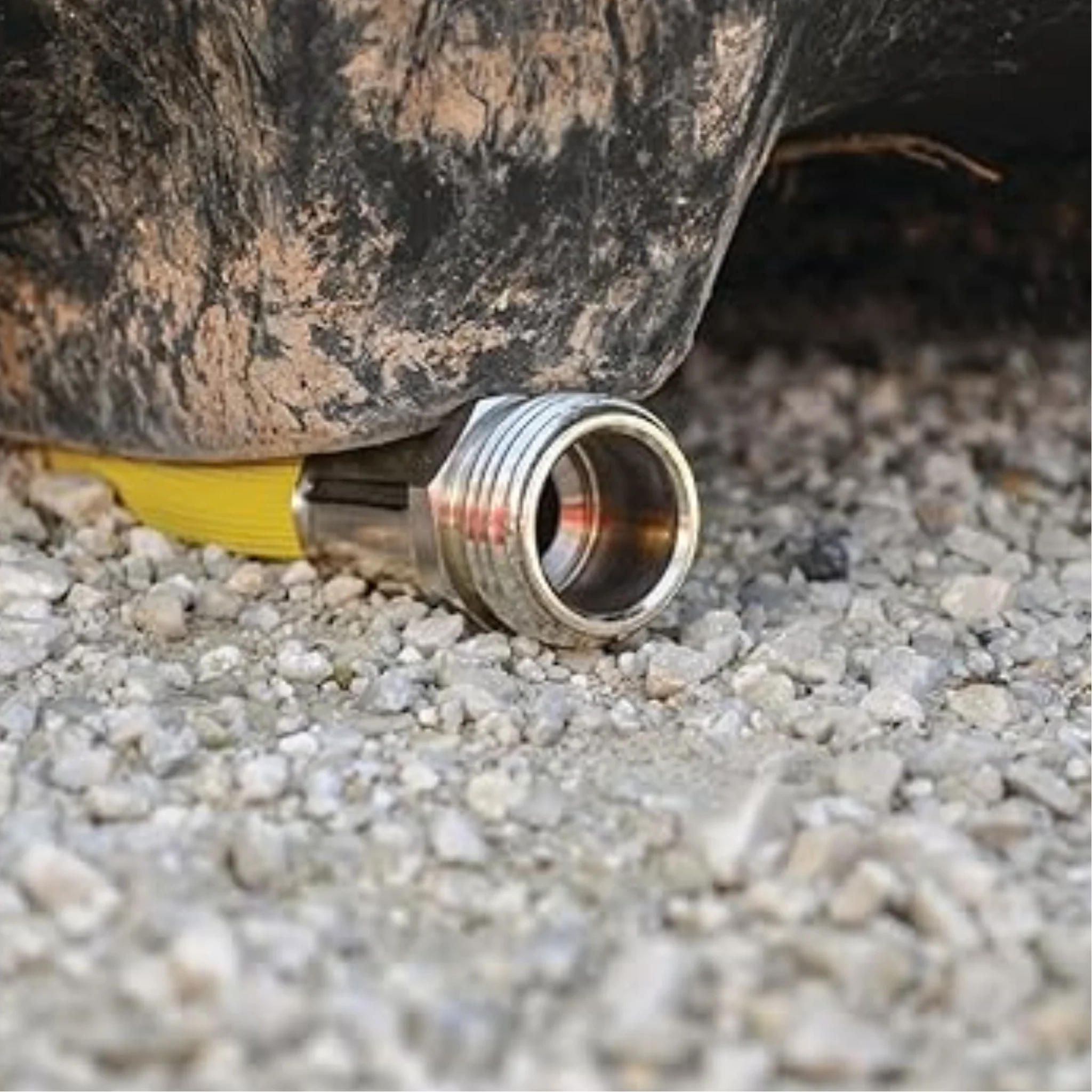 Dramm ColorStorm Yellow Hose under tire